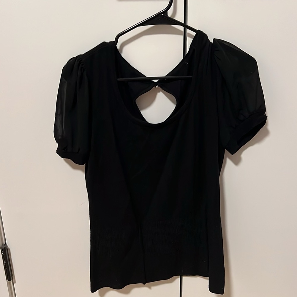 Black shirt with see through sleeves. Very soft. Key hole back button